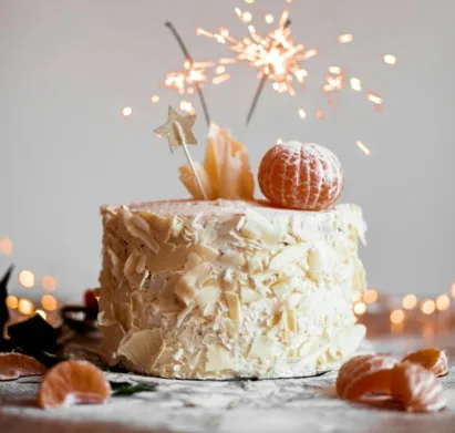 cake with lit sparkling stick