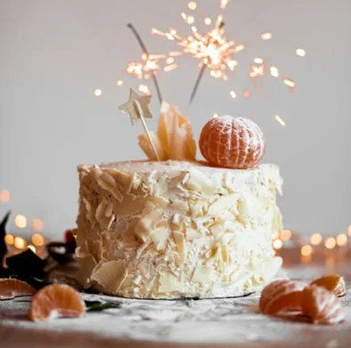 cake with lit sparkling stick